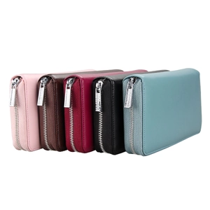 Detailed view of long leather RFID blocking wallets in five assorted colors with zippers