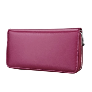 Macro view of leather texture and stitching detail on deep purple RFID zipper wallet