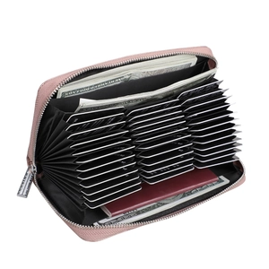Detail of rose gold leather passport wallet showing large capacity bellows card slots
