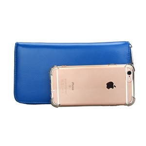 Blue leather RFID travel wallet next to a smartphone for clear scale and size comparison