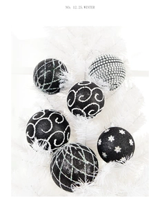 Set of six black and white glitter Christmas ornaments with geometric floral patterns