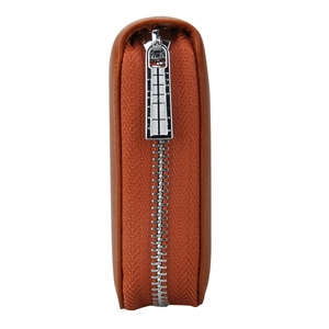 Close-up of brown leather wallet showing detailed silver zipper teeth and durable side seams