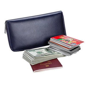Detail showing the large capacity of the blue leather RFID wallet with cash and passport
