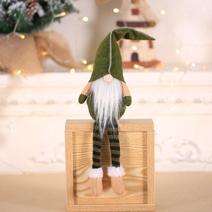 Nordic Christmas gnome plush decor with olive green hat and striped legs on wooden base
