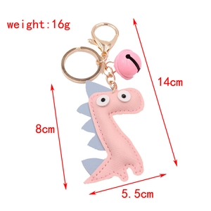 Pink PU leather dinosaur keychain with gold bell and dimensions 14x8x5.5cm