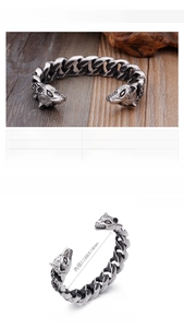 Detailed view of wolf head engraved stainless steel bracelet with sizing measurements
