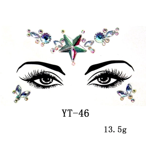 Close-up of YT-46 iridescent star and teardrop resin face jewels on display card