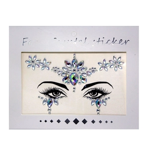 Detailed view of clear and iridescent facial crystal stickers with teardrop shapes