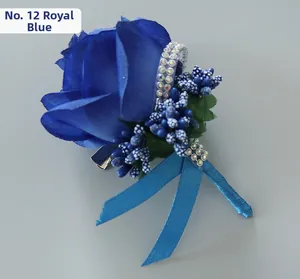 Detail of royal blue artificial silk rose boutonniere with beads and berries accents