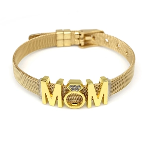 Detail of gold mesh strap bracelet featuring MOM charm with sparkling rhinestones