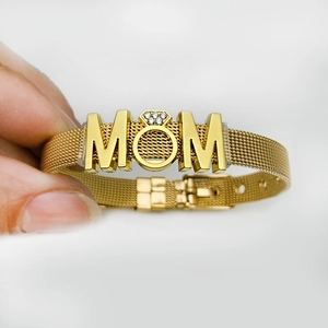 Golden mesh band bracelet with MOM lettering and diamond ring charm detail for mothers