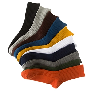 Set of colorful ribbed cotton crew socks for men in a variety of vibrant solid colors