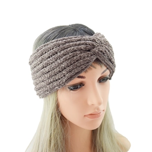 Detailed knit texture of a warm twist-knot headband in soft dark taupe velvet yarn