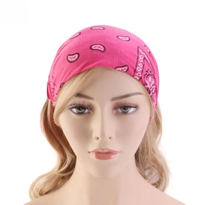 Detailed view of rose red paisley cotton headband worn on model for sports