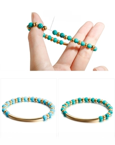 Elastic turquoise beaded bracelet detail showing strong stretch cord and metal beads