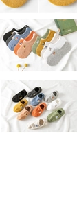 Close-up of cotton no-show socks featuring cute animal embroidery and silicone anti-slip grip