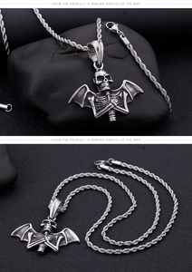Macro detail of retro punk bat skull pendant with twisted rope chain and lobster clasp