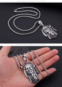 Detail of silver Indian chief head pendant on twist chain necklace for men and women