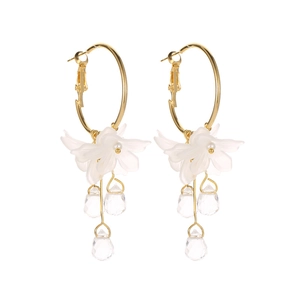 Elegant gold hoop earrings with white frosted flower petals and clear crystal teardrops