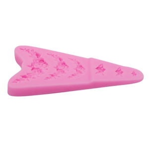 Moule en silicone rose avec motifs floraux et d'étoiles pour décorations en pâte à sucre