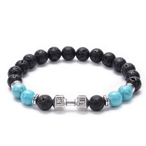 Detailed close-up of dumbbell beads with Live and Lift engravings on lava stone bracelet