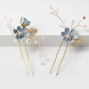 Handmade bridal hair pins with blue fabric flowers, pearls, and crystals in gold finish