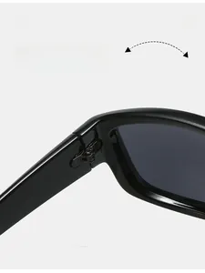 Close-up of durable metal reinforced hinges on Y2K black wrap-around cycling sunglasses