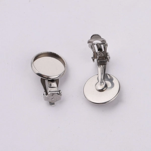 Macro detail of silver stainless steel clip-on earring bases with flat round tray components