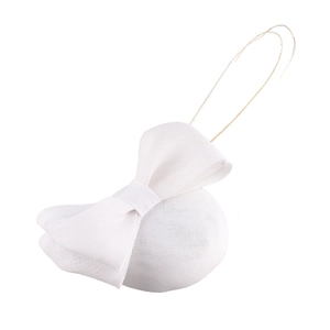 Close-up of a white vintage fascinator hat featuring a mesh bow on a round base