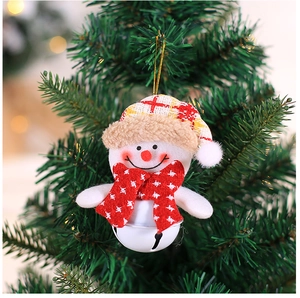 Close-up of a Christmas snowman plush ornament with plaid hat and golden bell on tree