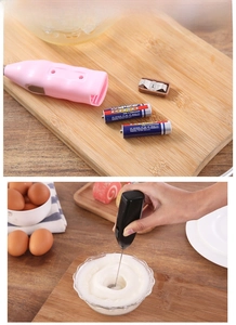 Detail of battery compartment and dual colors of handheld electric milk frother mixer