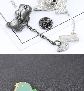 Detail of alloy cat and bone chain brooch with secure butterfly clasp closure