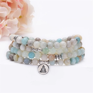 Detail of 108 mala beads bracelet with amazonite stones and silver buddha charm