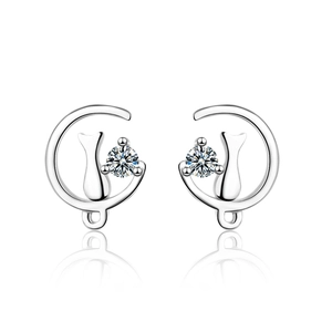 Silver cat on moon earrings with sparkling zircon crystals on white background