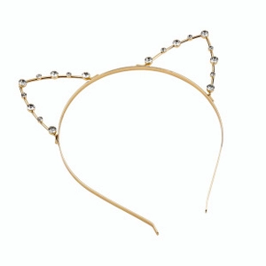 Close-up of golden cat ear headband with sparkling rhinestones on a white background