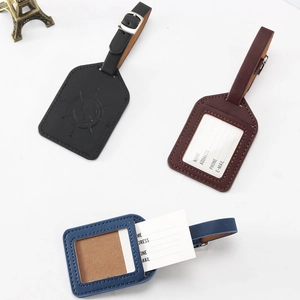 Faux leather luggage tags in black, brown, and blue with compass pattern and ID cards