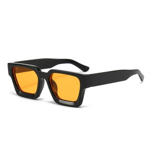 Trendy oversized square sunglasses with thick black frames and orange tinted lenses