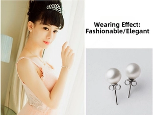 Detailed view of sterling silver pearl earrings featuring a white round bead and post-back design