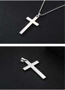 Detail view of silver stainless steel cross pendant featuring textured twist chain design