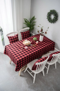 Detail of red and black buffalo plaid cotton linen tablecloth with matching cushion