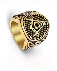 Detail view of gold Masonic signet ring with embossed G symbol and black enamel finish