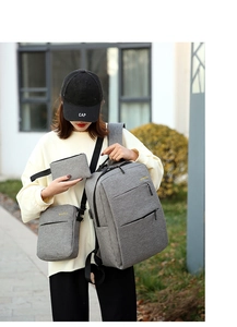 Three-piece grey Oxford water-resistant business backpack set with crossbody and small pouch