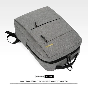 Detail of grey oxford business backpack with yellow lettering and waterproof zipper