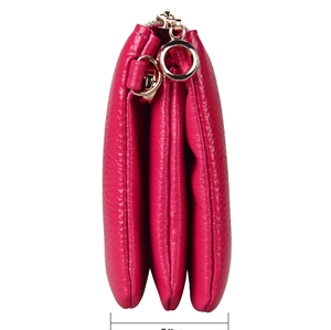 Side view of rose red leather crossbody bag showing its 50mm three-layer accordion structure