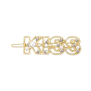 Golden KISS letter hair clip with sparkling rhinestones and pearls on white background