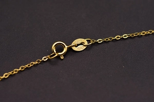 Macro shot of gold-plated S925 sterling silver lobster clasp with Italy hallmark detail