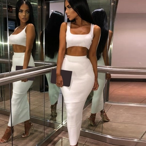 Detail view of white ribbed knit two-piece set featuring crop top and high waist maxi skirt