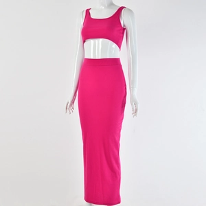 Detail of rose red ribbed knit two-piece set featuring cropped tank top and maxi skirt