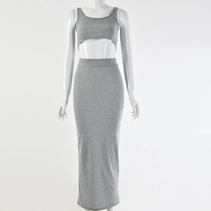 Detail view of a grey ribbed fabric two-piece set with crop top and long maxi skirt