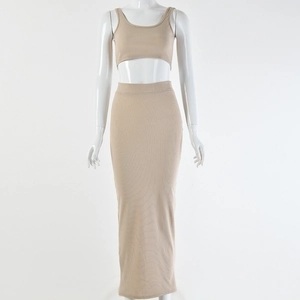 Detailed view of beige ribbed knit crop top and high waist maxi skirt set on a mannequin